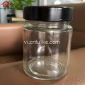 Hũ tròn mặt thẳng bằng thủy tinh màu hổ phách có nắp kim loại màu đen 200ml